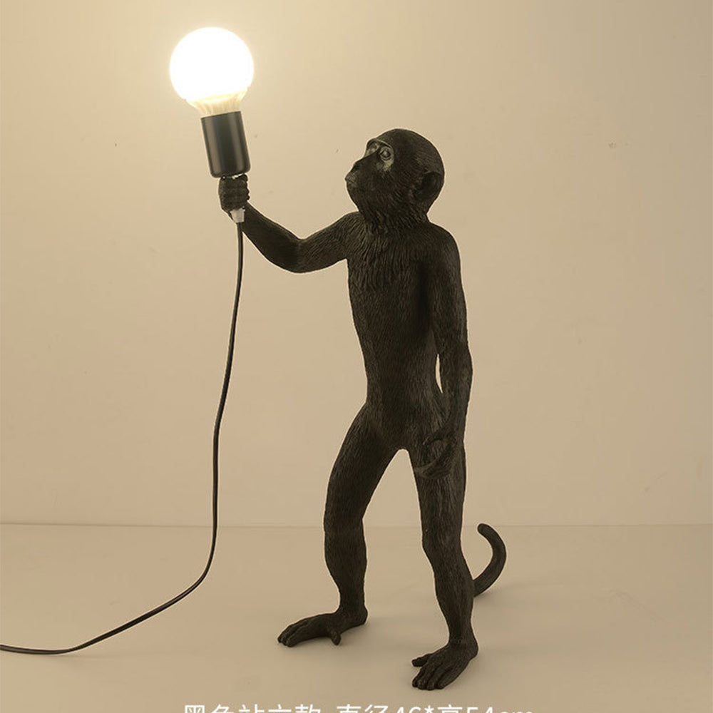 Modern monkey table lamp as bedroom decor element