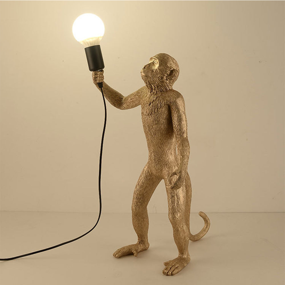 Modern monkey table lamp as bedroom decor element