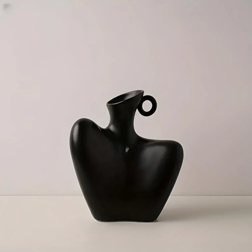 Vaso decorativo con motivo artistico che ricorda la clavicola