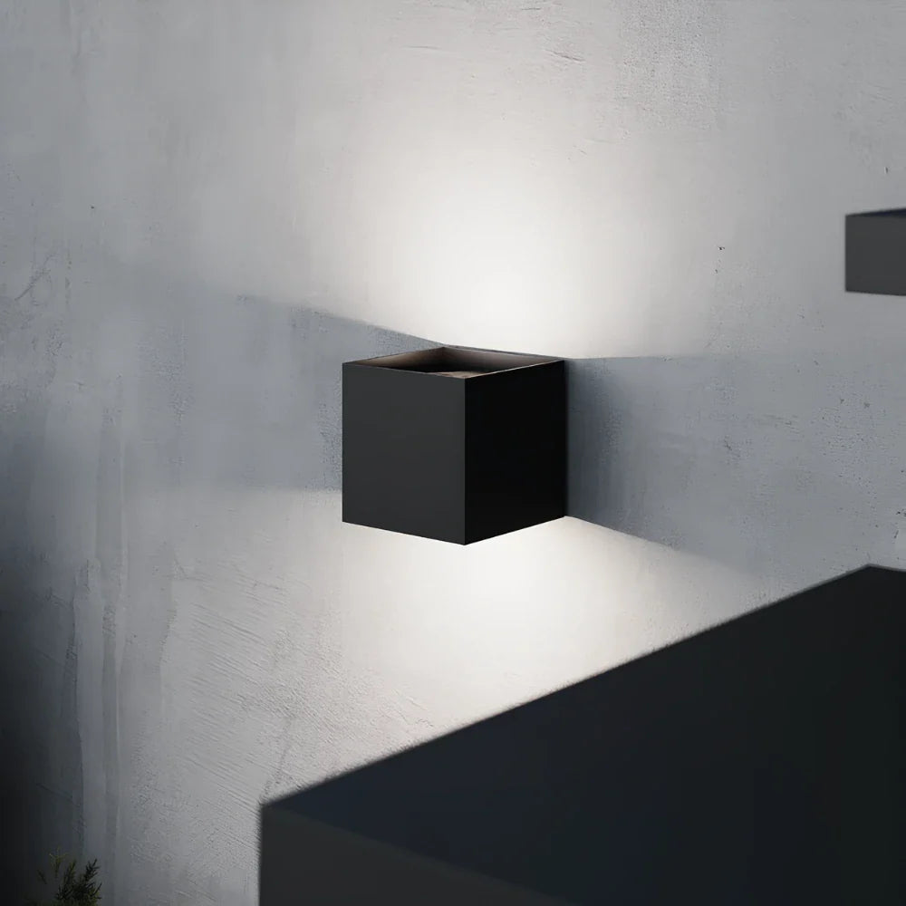 Modern cube-shaped wall sconce with adjustable light angle