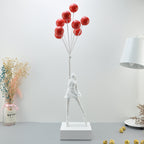 Statua moderna di bambina con palloncino