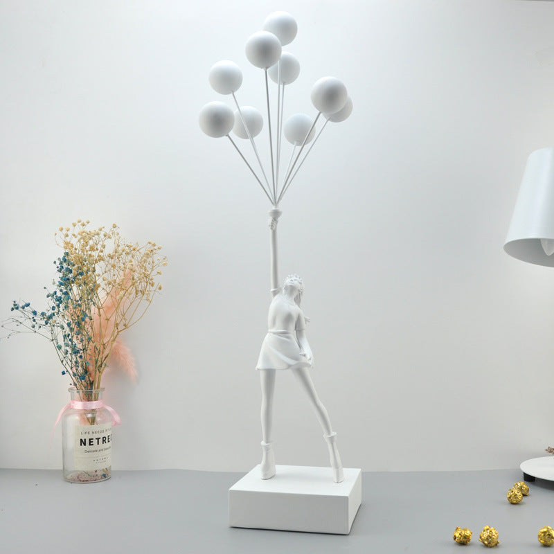 Statua moderna di bambina con palloncino