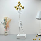 Statua moderna di bambina con palloncino