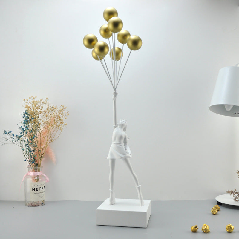 Statua moderna di bambina con palloncino