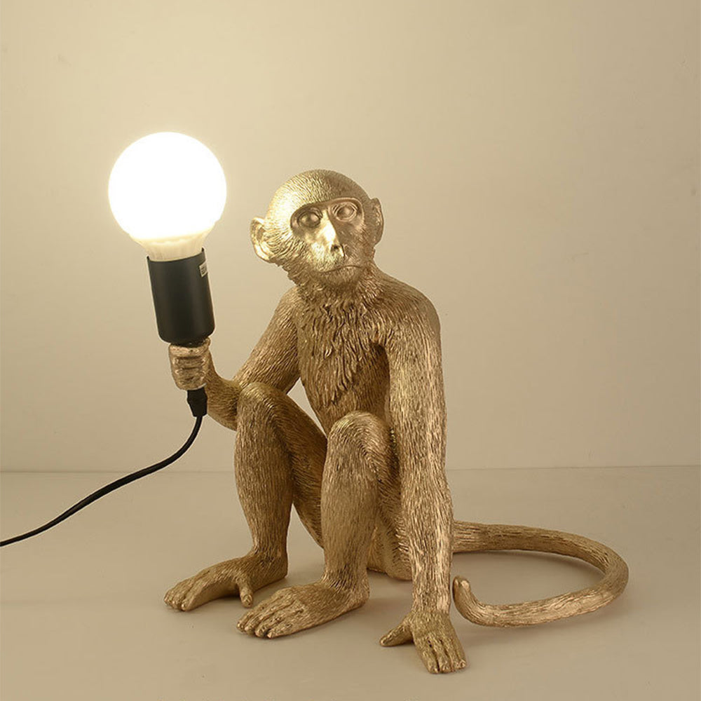 Modern monkey table lamp as bedroom decor element