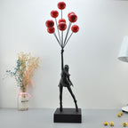 Statua moderna di bambina con palloncino