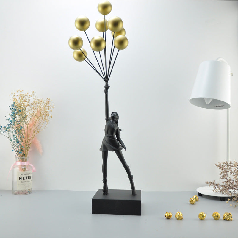 Statua moderna di bambina con palloncino