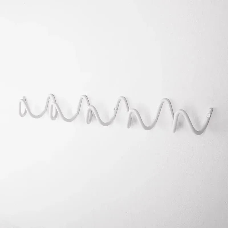 Space-saving wall hanger with multiple hooks wave