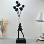 Statua moderna di bambina con palloncino