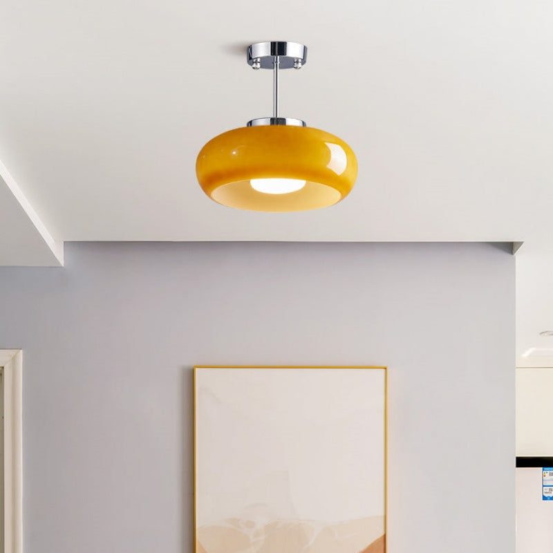 Classic round glass ceiling lamp in a warm amber shade