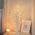 Set of decorative LED table lamps shaped like birch trees with warm light