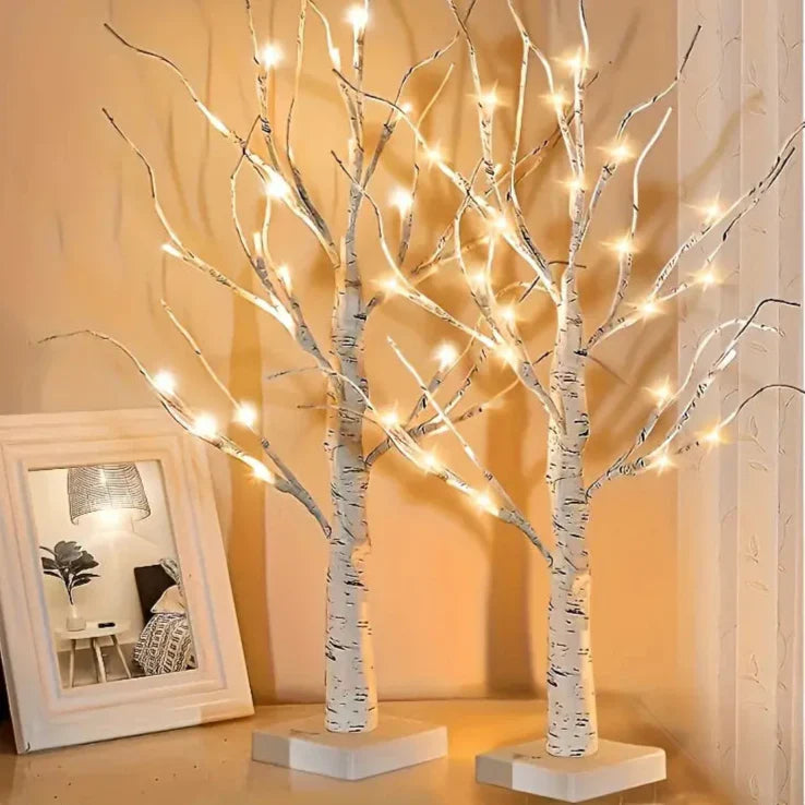Set of decorative LED table lamps shaped like birch trees with warm light
