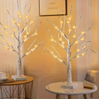 Set of decorative LED table lamps shaped like birch trees with warm light