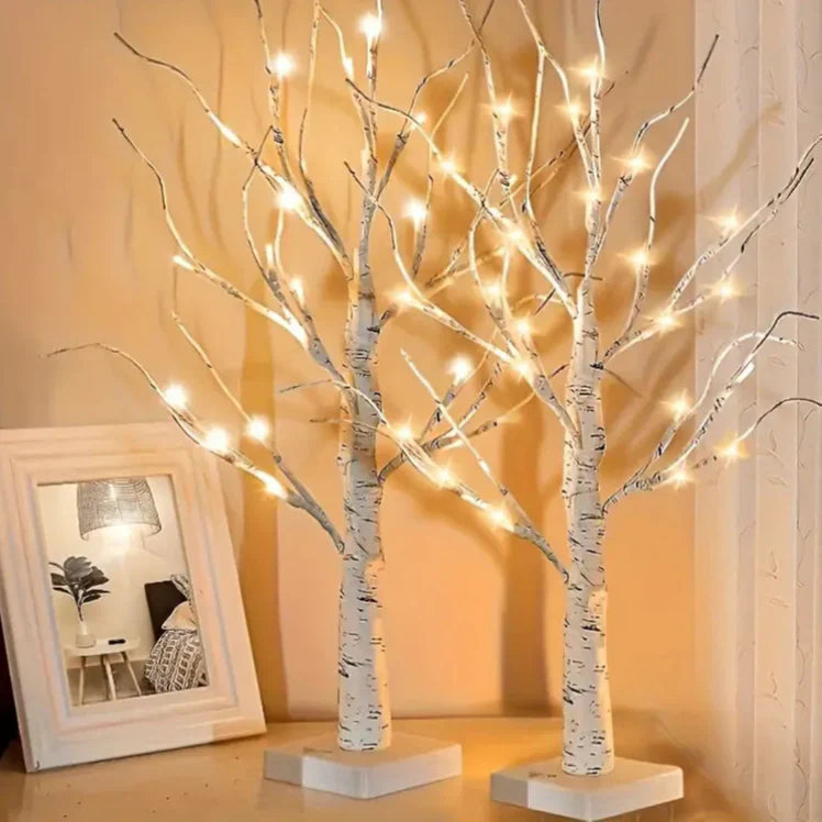 Set of decorative LED table lamps shaped like birch trees with warm light