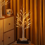 Set of decorative LED table lamps shaped like birch trees with warm light