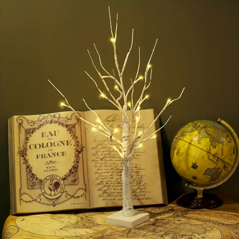 Set of decorative LED table lamps shaped like birch trees with warm light