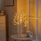 Set of decorative LED table lamps shaped like birch trees with warm light