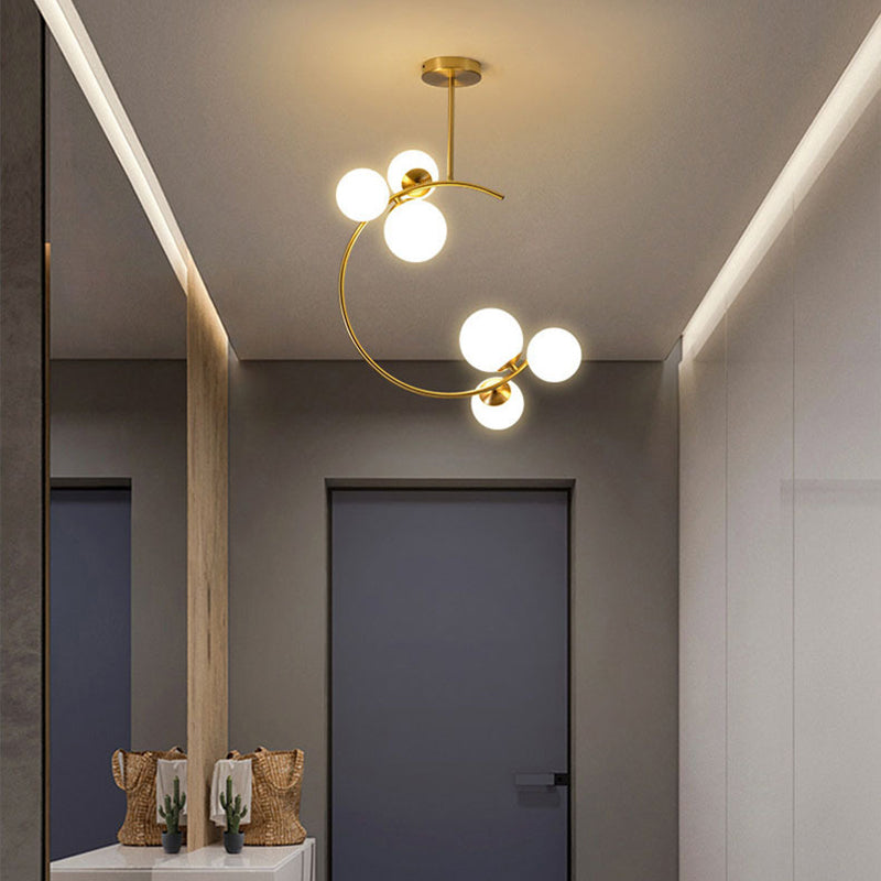 Cozy Scandinavian glass ceiling lamp in curved globe shape