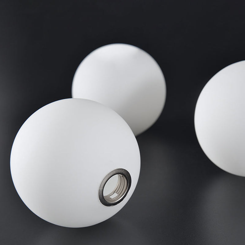 Cozy Scandinavian glass ceiling lamp in curved globe shape