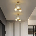 Cozy Scandinavian glass ceiling lamp in curved globe shape