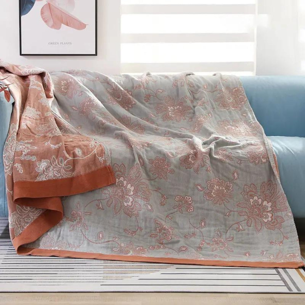 Coperta elegante e accogliente con motivo floreale per tutte le stagioni