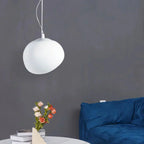 Artistic pendant lamp with frosted glass and pebbles for dining rooms and living rooms