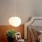 Artistic pendant lamp with frosted glass and pebbles for dining rooms and living rooms