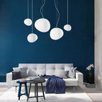 Artistic pendant lamp with frosted glass and pebbles for dining rooms and living rooms