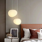 Artistic pendant lamp with frosted glass and pebbles for dining rooms and living rooms