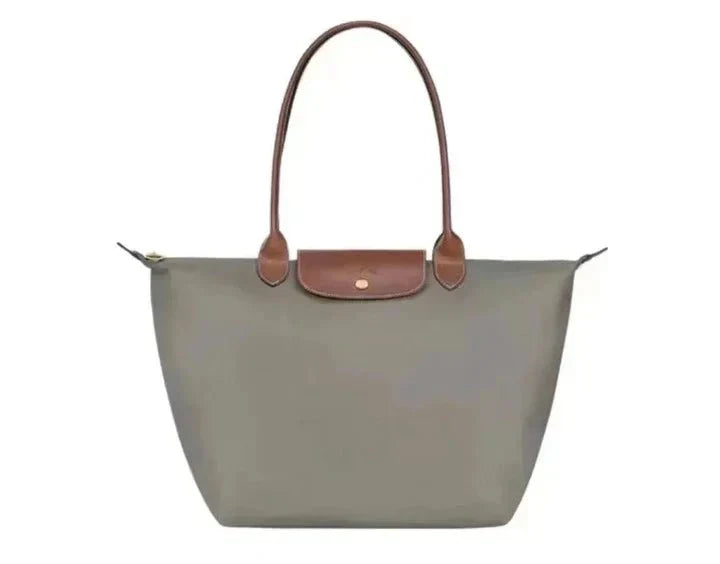 Women's handbag with a minimalist style, rigid shape, and handle