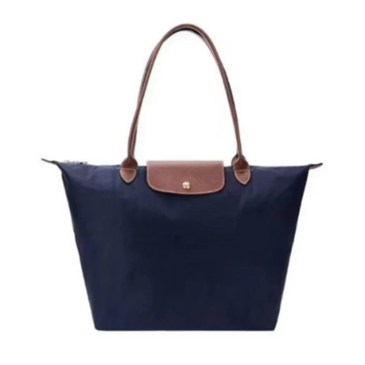 Women's handbag with a minimalist style, rigid shape, and handle