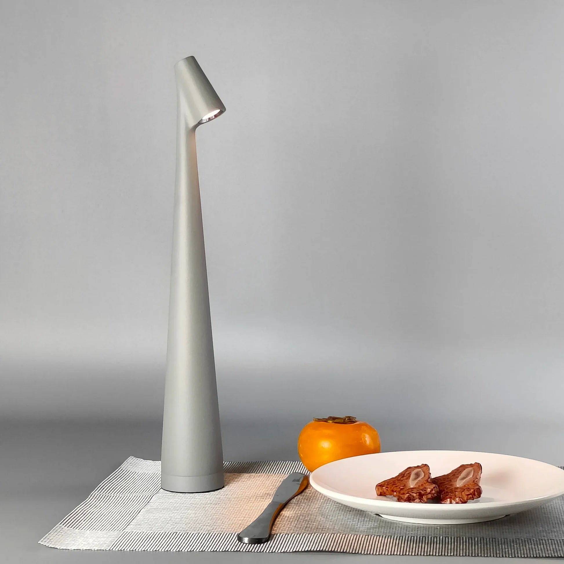Compact wireless LED table lamp with brightness adjustment