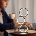 Decorative round stack LED desk lamp with warm ambient lighting