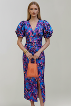 Women's airy midi dress with V-neckline, puff sleeves, and ruched waist, patterned