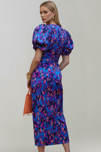 Women's airy midi dress with V-neckline, puff sleeves, and ruched waist, patterned