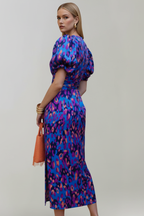 Women's airy midi dress with V-neckline, puff sleeves, and ruched waist, patterned