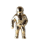 Wazon z figurką astronauty: nowoczesny akcent wystroju w stylu kosmicznym