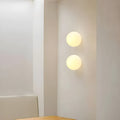 Flush Mount Globe Wall Sconce with Frosted Glass and Modern Minimalist Design - Image 1