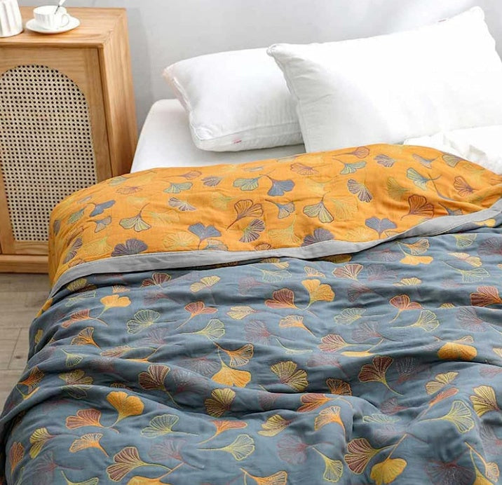 Coperta reversibile accogliente con motivo foglie naturali