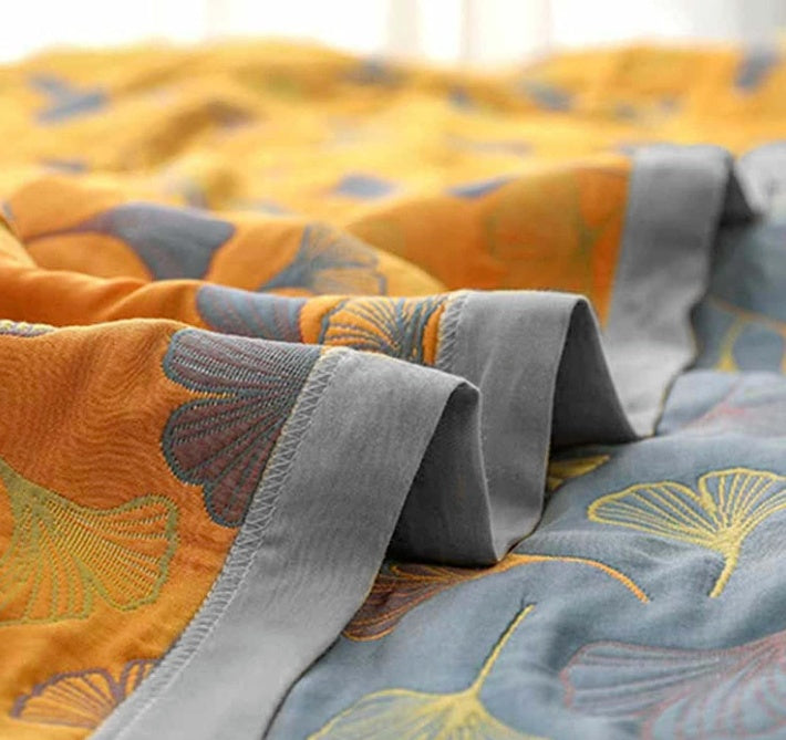 Coperta reversibile accogliente con motivo foglie naturali