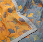 Coperta reversibile accogliente con motivo foglie naturali