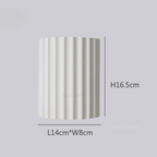 Elegancka okrągła lampa ścienna w delikatnych kolorach