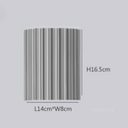 Elegancka okrągła lampa ścienna w delikatnych kolorach